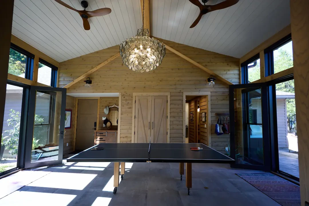 spacious living room with a ceiling fan 