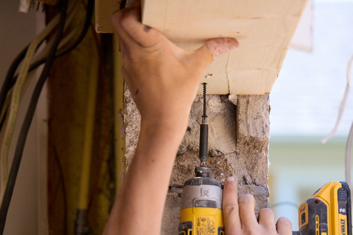Person drilling a wood