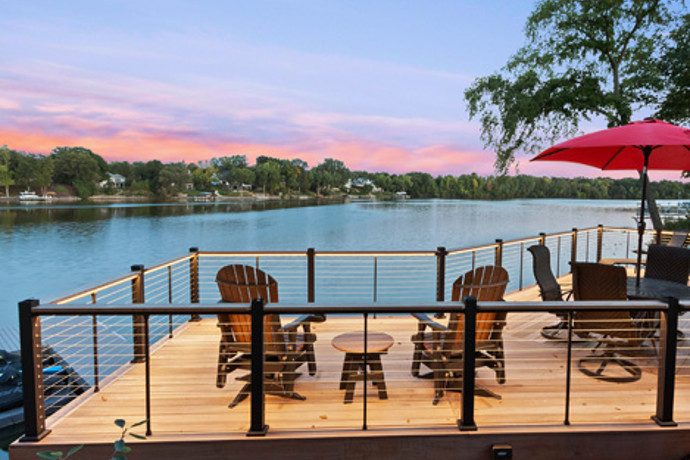 Deck with a view of the sky and river