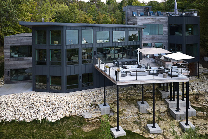Black modern luxury home in the woods in Door county.