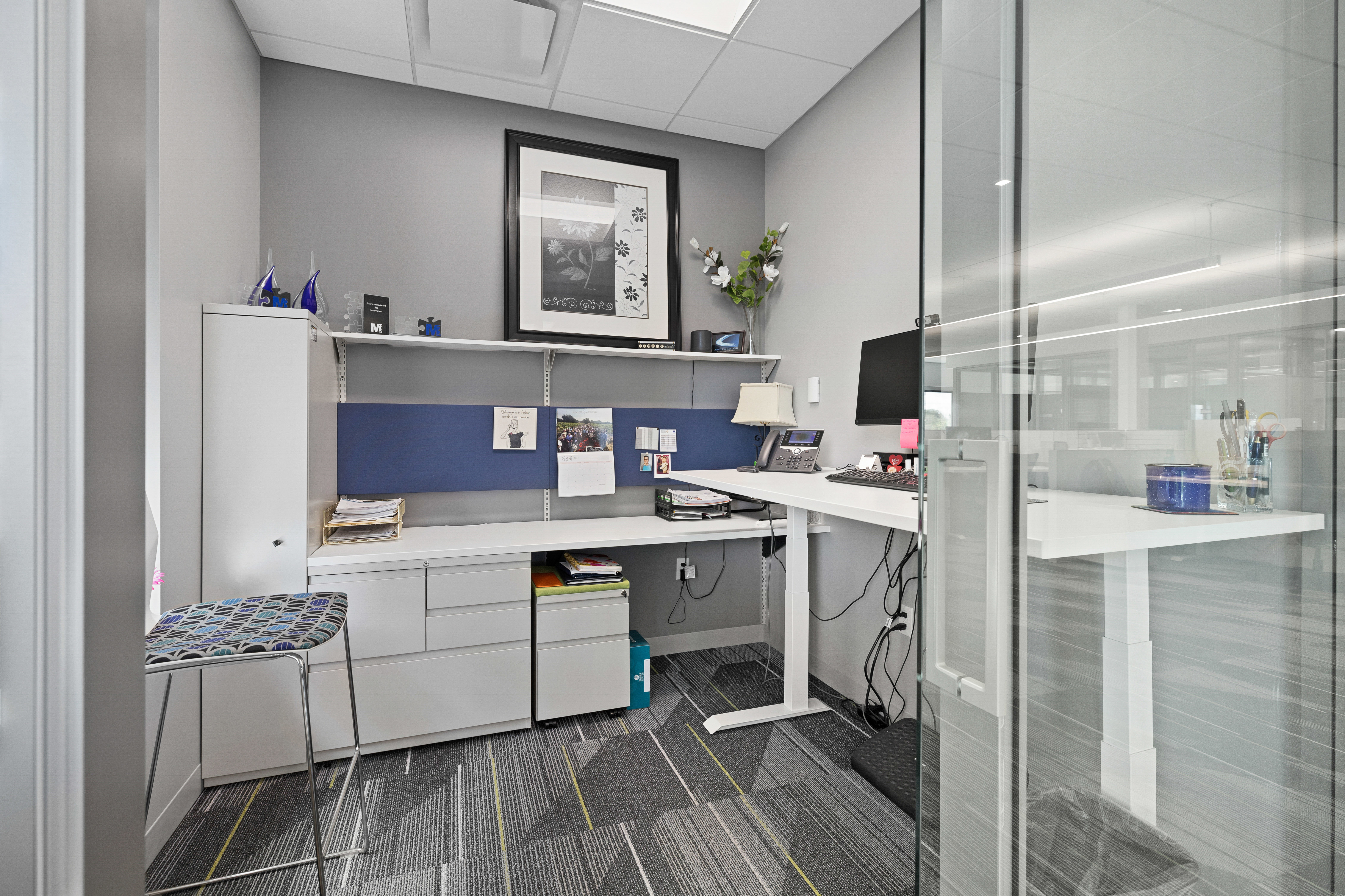 office space with images on the wall making it more personal