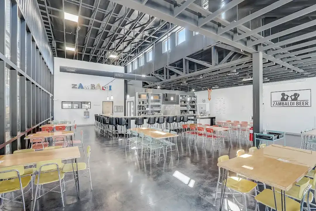 office space with dark furniture and black tile flooring