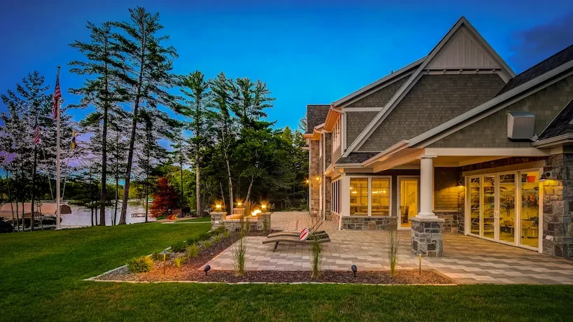 Backyard of newly built luxury home sitting on a lakeside